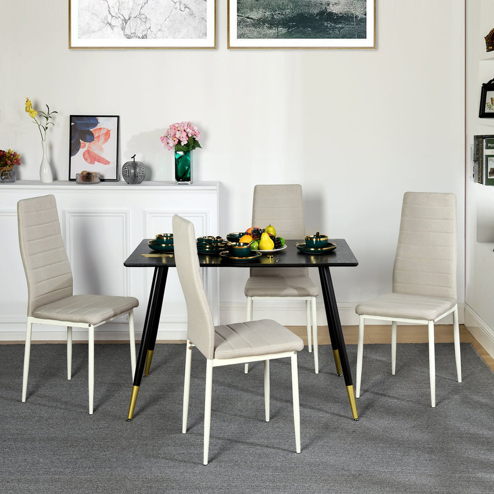set of four beige fabric dining chairs with metal legs-modern and comfortable seating for dining or home use