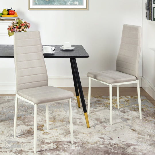 set of four beige fabric dining chairs with metal legs-modern and comfortable seating for dining or home use